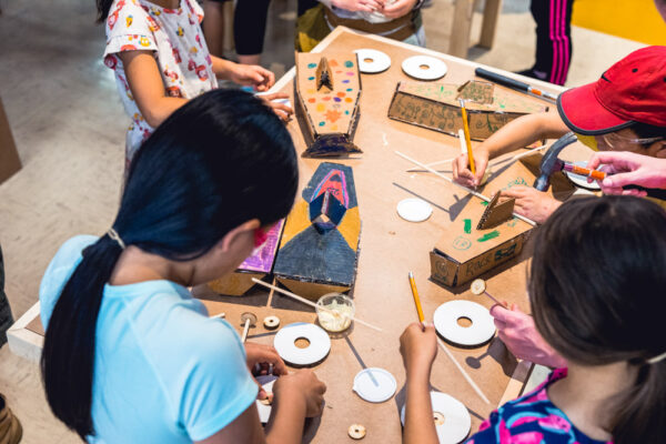 These campers are hard at work building their own cars!