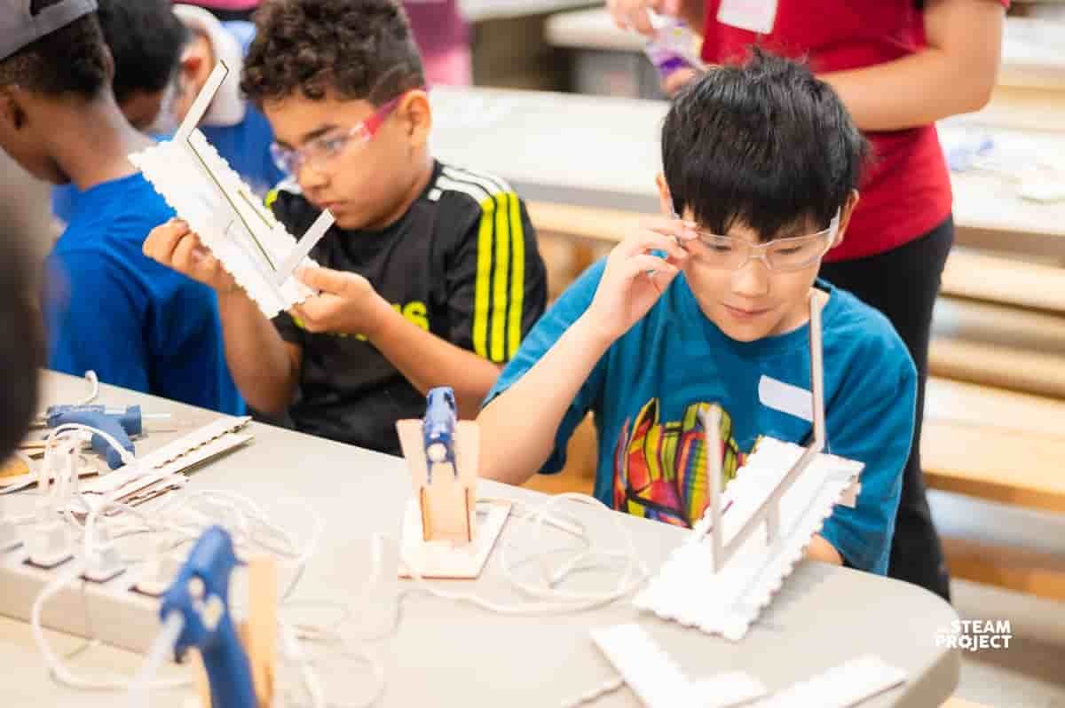 Campers experiencing engineering concepts at The STEAM Project